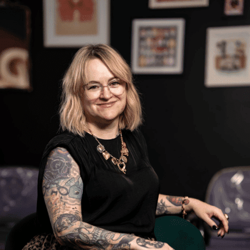 Portrait of Cassie (She/Her), a professional stylist at Rebel Hair, showcasing their expertise and style.