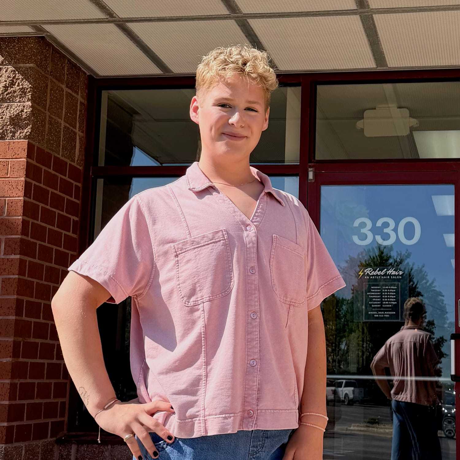 Portrait of Jackson (He/Him), a professional stylist at Rebel Hair, showcasing their expertise and style.