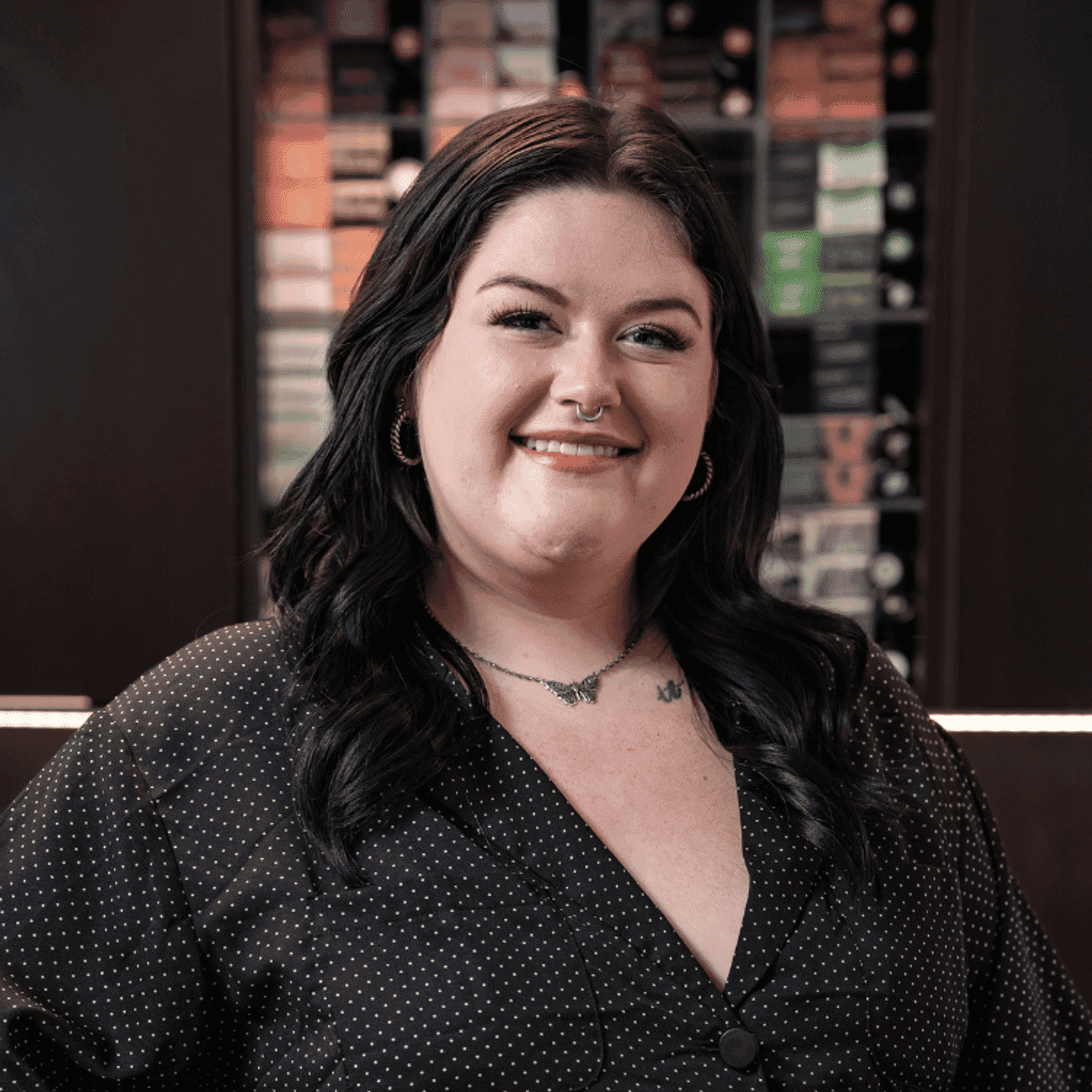 Portrait of Ash (She/Her), a professional stylist at Rebel Hair, showcasing their expertise and style.