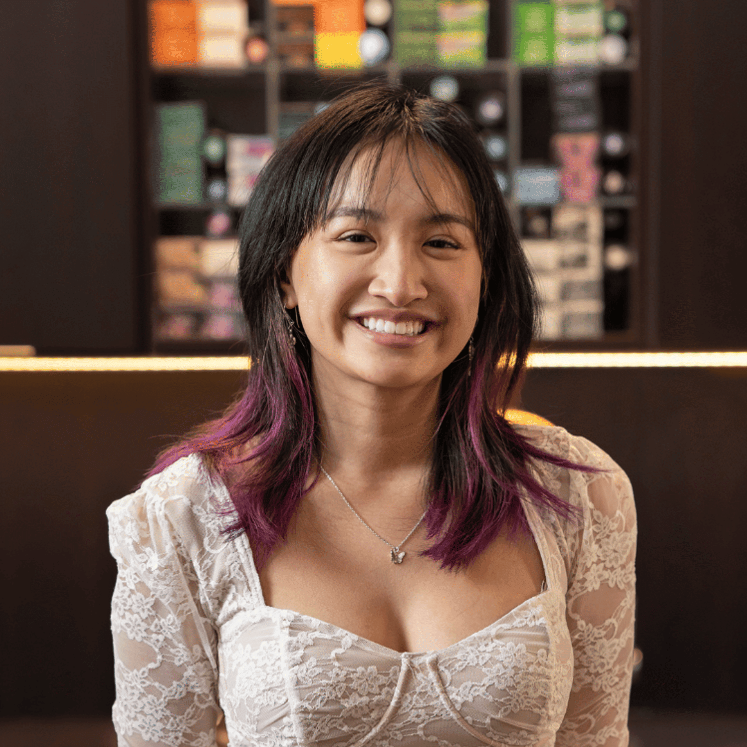 Portrait of May (She/Her), a professional stylist at Rebel Hair, showcasing their expertise and style.