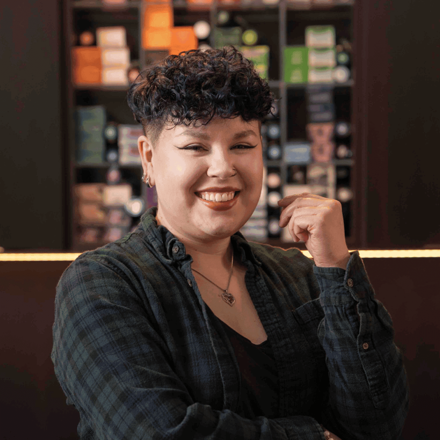 Portrait of Meikayla (She/Her), a professional stylist at Rebel Hair, showcasing their expertise and style.