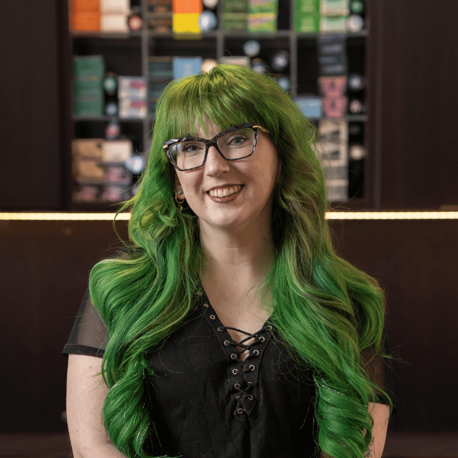 Portrait of Majestica, a professional stylist at Rebel Hair, showcasing their expertise and style.