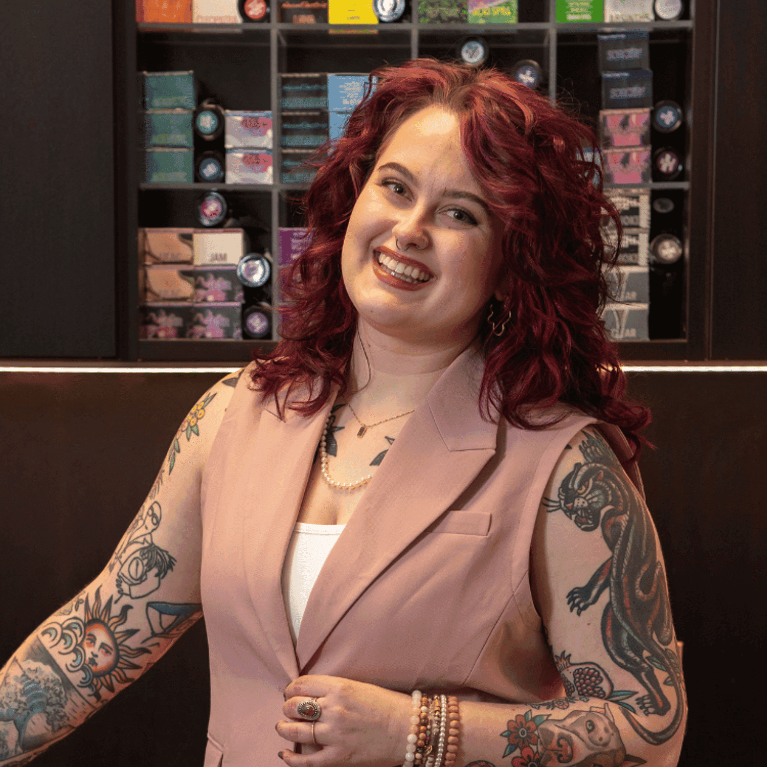 Portrait of Mya (She/They), a professional stylist at Rebel Hair, showcasing their expertise and style.