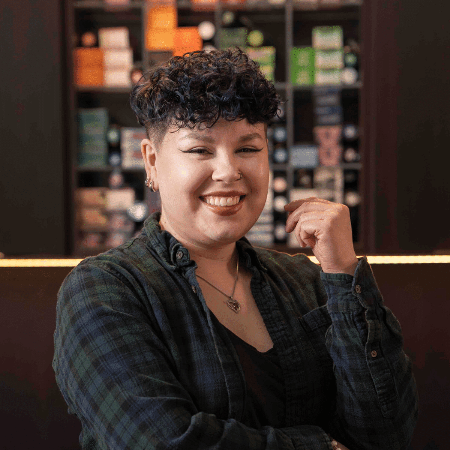 Portrait of Meikayla, a professional stylist at Rebel Hair, showcasing their expertise and style.